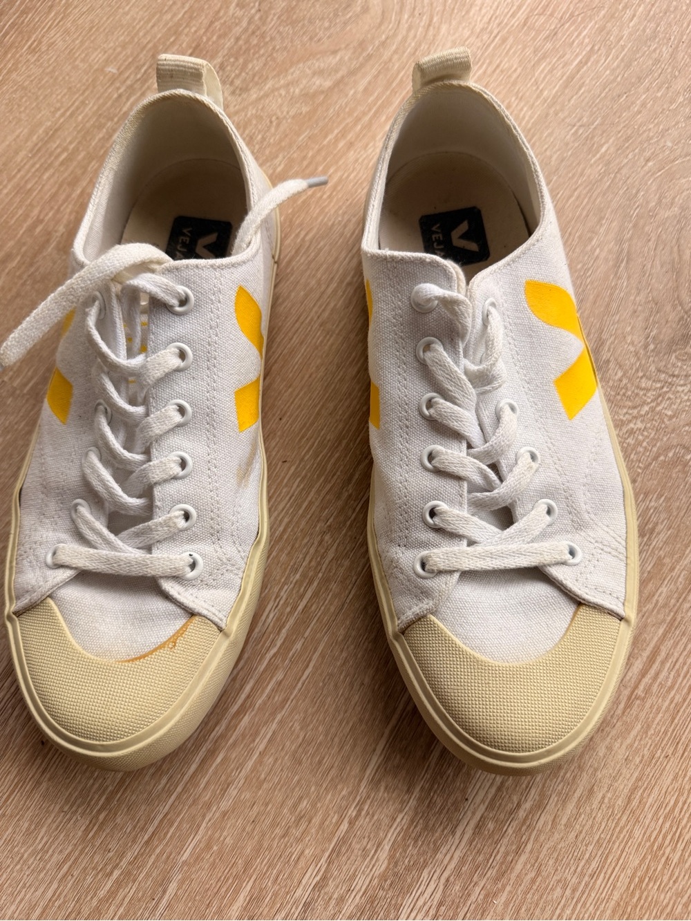 Veja women’s Canvas Low-Top Sneakers in White with Yellow V